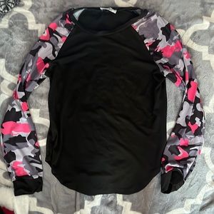 Black top with camo sleeves.